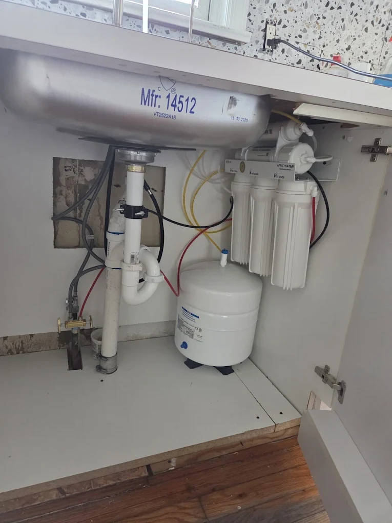 Under-sink reverse osmosis water filtration system installation